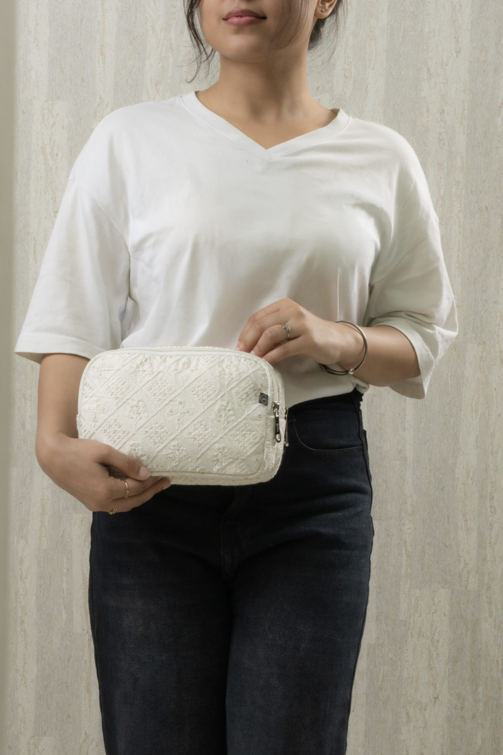 Close-up of stitching a canvas bag, needle capturing thick durable thread